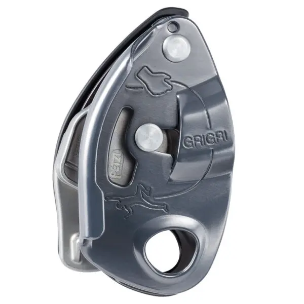 A gray and silver Petzl GRIGRI® Belay Device designed for rock climbing. The device features a rotating cam mechanism and an attached handle for controlling the descent of the rope. The word "GRIGRI" is inscribed along with a small illustration of a climber.