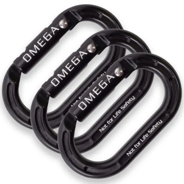 Three black Omega Pacific Micro Raider Aluminum Keylock Straightgate carabiners with "OMEGA" and "Not for Life Safety" printed on them are arranged in a slightly overlapping manner. The carabiners are oval-shaped and feature a screw-lock mechanism.