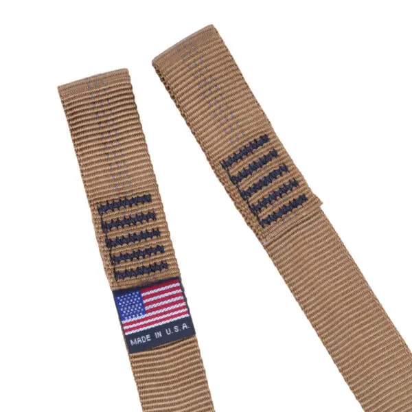 Two Ape Canyon Outfitters Single Step Aider straps are pictured, featuring black stitching resembling American flag designs. One strap includes a tag with a full-color American flag and the text "MADE IN U.S.A." below it. The ends of the straps are frayed.