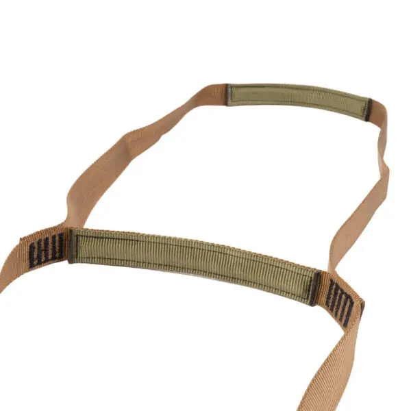 A flat, brown strap with a green section and black text on one end. It appears to be a piece of gear or accessory made of fabric, possibly a drawstring or a part of a larger equipment item. The Ape Canyon Outfitters 2 Step Aider is laid out flat against a white background.