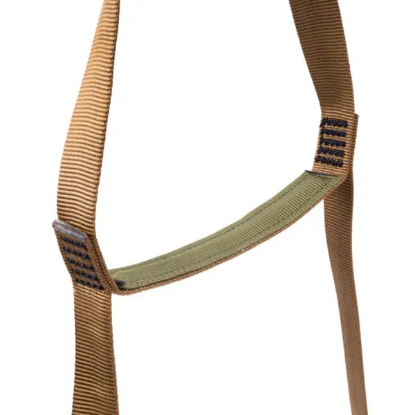 A close-up image of a tan nylon strap with black stitching and a green padded section in the middle. The strap appears to be part of the Ape Canyon Outfitters 2 Step Aider.