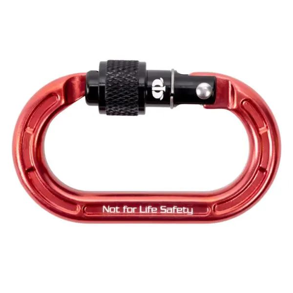 A red metal Omega Pacific Micro Raider Aluminum Keylock Screw-Lok with a black locking screw gate is labeled "Not for Life Safety." The carabiner has an oval shape and a smooth, polished finish. The black locking mechanism ensures that the gate remains securely closed.