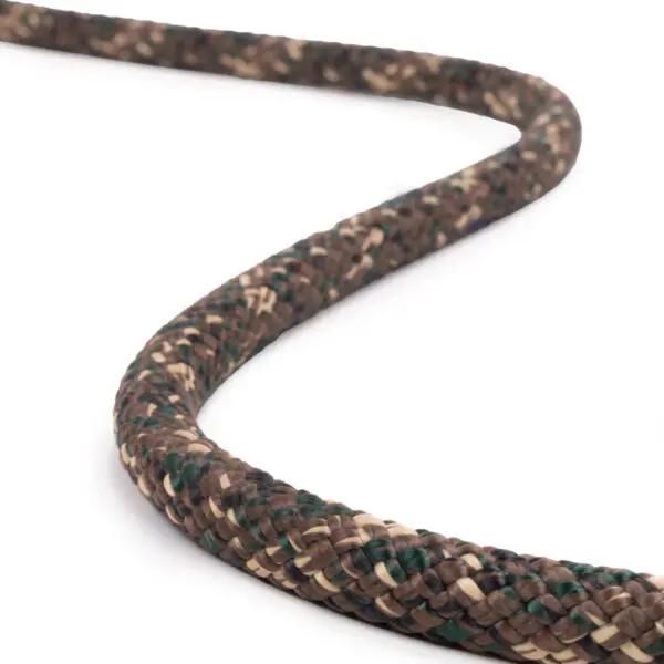 A close-up of an Ape Canyon Outfitters 9.5mm Ghillie with a woodland camouflage pattern consisting of brown, green, and beige colors. The rope is positioned diagonally across a white background, tapering into the distance.