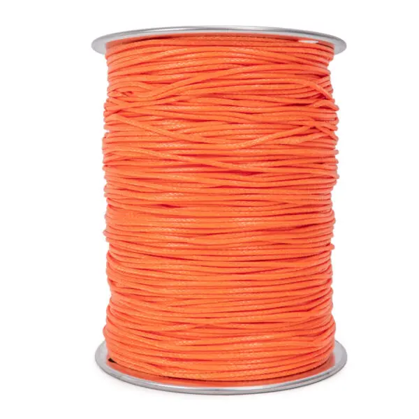 A large spool of Ape Canyon Outfitters 2.2mm Orange Oasis is shown. The cord is neatly wound around the spool, which has silver-colored rims at the top and bottom.