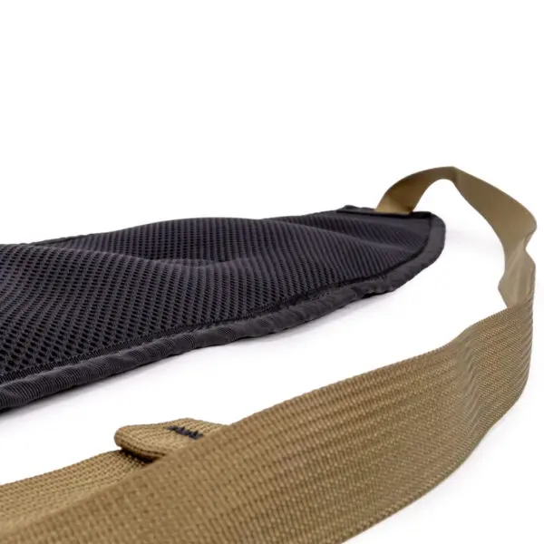 Close-up view of a two-tone, padded shoulder strap. The Ape Canyon Outfitters Lazy Hunter Band Kryptek Highlander features a black, breathable mesh padding for comfort and a sturdy brown nylon section. The image highlights the texture and materials of the strap against a white background.