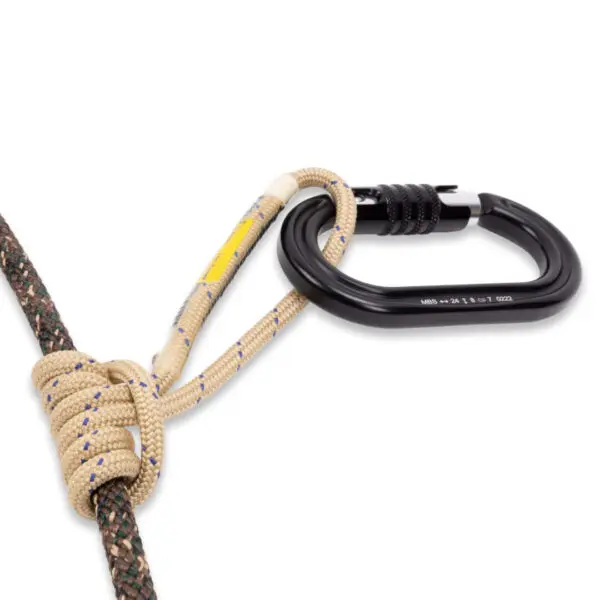 An Ape Canyon Outfitters 9.5mm Ghillie Tether Kit is attached to two ropes: a beige rope tied in a friction hitch around a thicker green and black rope. The kit is securely connected, demonstrating a commonly used setup in climbing or rope access activities.