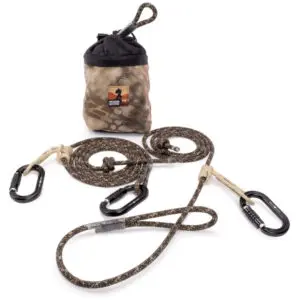 An Ape Canyon Outfitters 9.5mm Ghillie Lineman and Tether Kit is displayed with two coiled ropes featuring black carabiners at the ends. The bag has a drawstring closure and a logo with a silhouette of a climber.