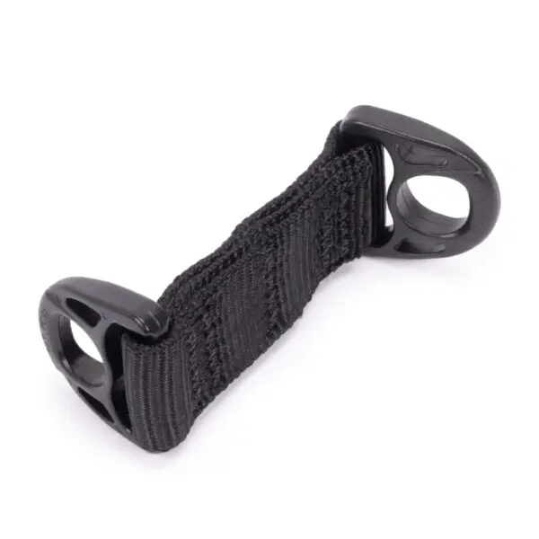 A close-up image of a black plastic and fabric strap with holes on each end. The Ape Canyon Outfitters Lanyard Minder appears durable, featuring reinforced stitching and a textured surface. The ends are rigid, possibly intended for attaching or securing purposes in various applications.
