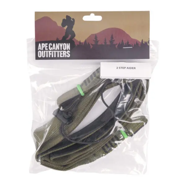 A packaged Ape Canyon Outfitters 2 Step Aider from Ape Canyon Outfitters, featuring green straps with black details. The packaging has a scenic mountain background and shows the product label displaying "Ape Canyon Outfitters 2 Step Aider.