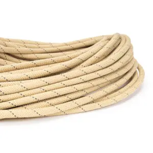 Close-up of a coiled Ape Canyon Outfitters Rogue 9.5mm with black specks. The rope is thick and neatly coiled, occupying the center of the image against a plain white background.

