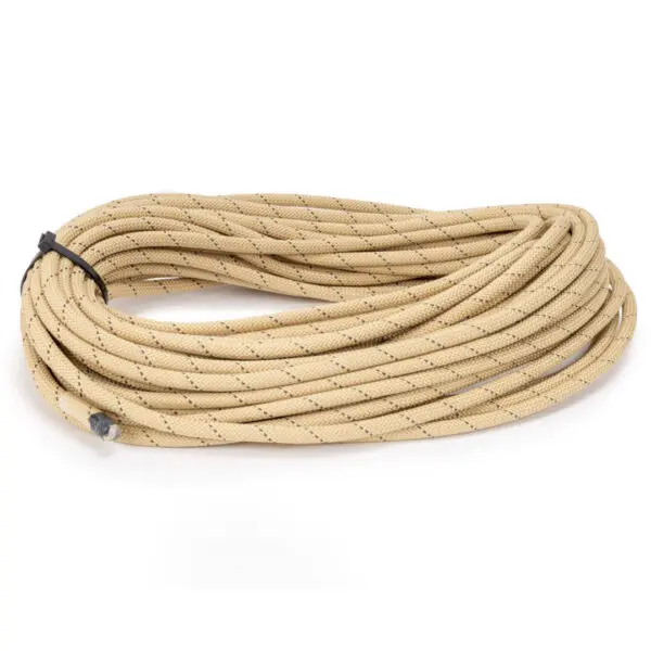 A coiled beige Ape Canyon Outfitters Rogue 9.5mm climbing rope with black specks is neatly tied with a black strap. The ends are secured with gray plastic caps. The rope appears thick and durable, suitable for climbing or outdoor activities.