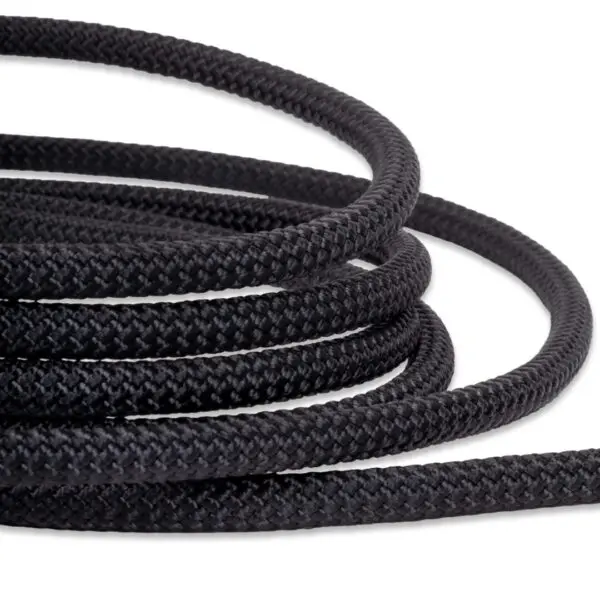 Close-up of Ape Canyon Outfitters 9.5mm Raven With Squatch Splice on a white background. The rope has a textured surface, evident from its woven appearance, and is shown looped multiple times, creating a pattern of curved lines.