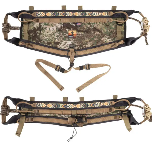 Introducing the Ape Canyon Outfitters Pioneer Saddle Obskura Transitional, an adjustable camouflage utility belt with various straps and buckles designed for outdoor use. The belt features an intricate tribal pattern on a section of its webbing and several loop attachments for securing gear.