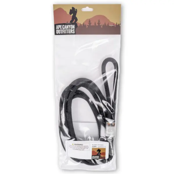 A packaged Ape Canyon Outfitters 9.5mm Raven Tree Tether/Linemans Belt from Ape Canyon Outfitters. The packaging has an illustration of a mountainous landscape with a silhouette of a tall, humanoid figure. There is a warning label visible on the front of the packaging.