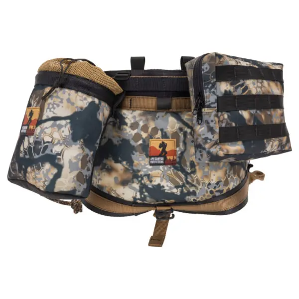 A tactical camouflage waist pack with multiple attached pouches. The Ape Canyon Outfitters Pioneer Saddle Obskura Skyfall With Cobra Pro Style Buckles features a central belt with two large pouches on either side and a smaller rectangular pouch on the right. There are also visible buckles and attachments.