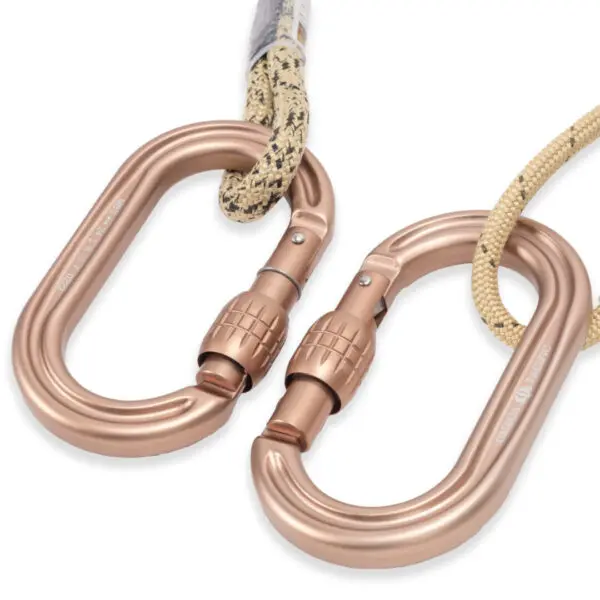 Two bronze-colored Ape Canyon Outfitters 8mm Resc Tech Lineman Belt with Screw Lock Carabiners are attached to climbing ropes. Both carabiners have a screw-lock mechanism for added security, ensuring the ropes stay securely fastened. The ropes are beige with a black pattern. The image likely depicts climbing or safety gear.