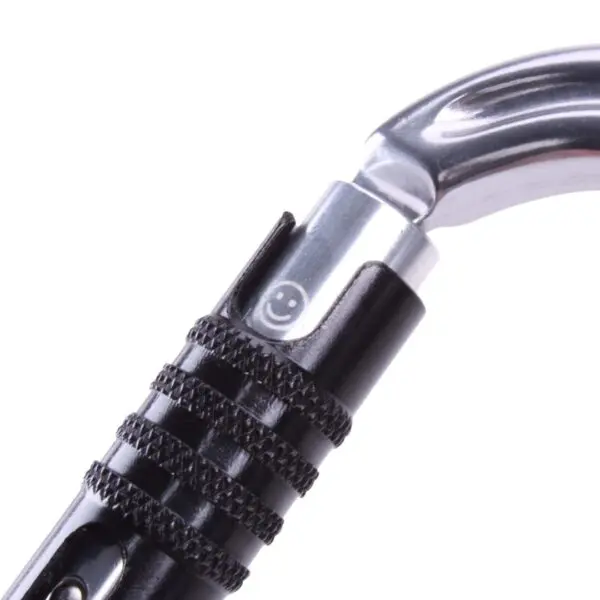 Close-up image of a black and silver Omega Pacific Raider Aluminum Keylock 3-Stage Quik-Lok W/Captive Eye NFPA. The latch features a small engraved smiley face symbol.