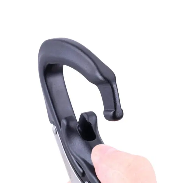 A close-up image of an Omega Pacific Squatch Claw Aluminum Double Action Quik-Lok, which appears to be in the action of being opened by a thumb. The design features a curved latch and a hook, indicating it may be used to attach or secure items. The background is plain white.