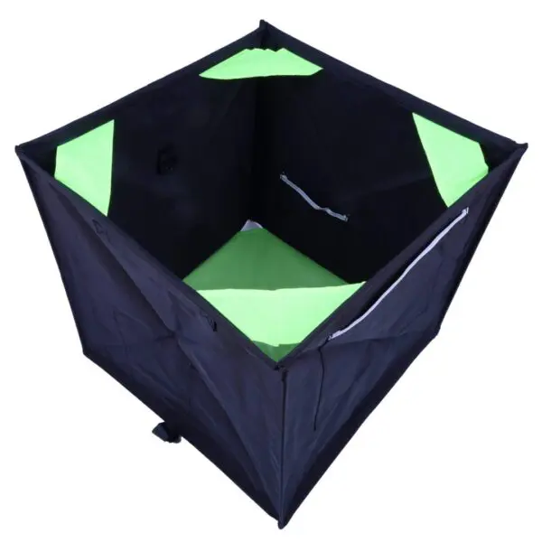 A portable black and green RNA COLLAPSIBLE THROWLINE CUBE tent designed for product photography, viewed from above, showcasing its open top and interior led lighting panels.
