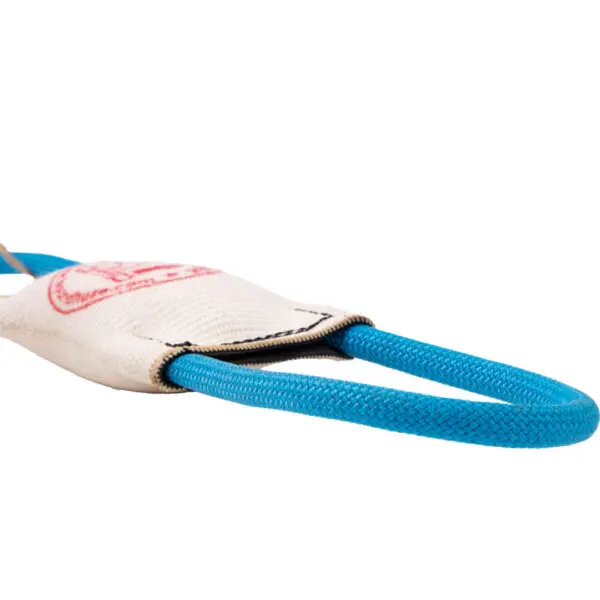 Close-up of a Hound Hose Dog Tug Toy secured with a white fabric strap, which features a red logo. The toy's texture is visible, and the white strap appears to be made of durable material, likely used for safety in climbing activities.