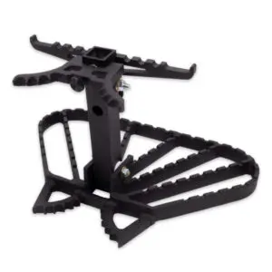 A black Ape Canyon Outfitters Kodiak Platform for hunting, featuring serrated, non-slip footrests and a central support column with a mounting bracket and adjustable screws. The design provides stability and safety for hunters while positioned in a tree.