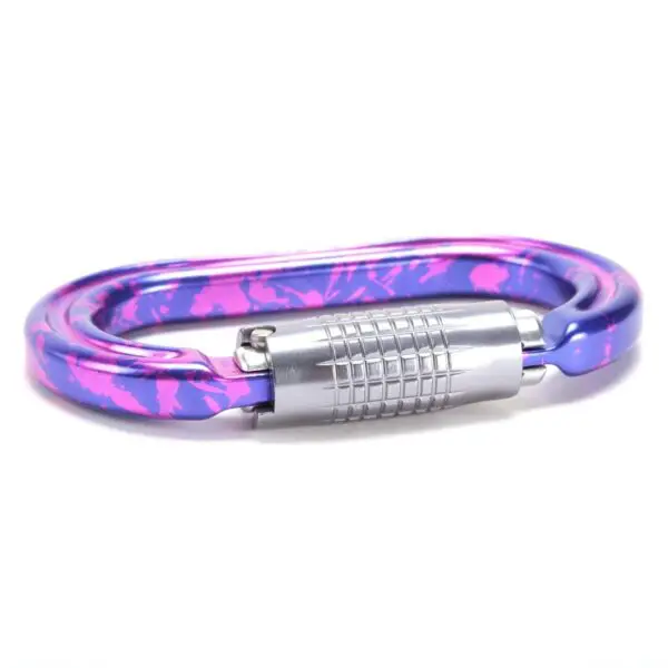 An Omega Pacific Raider+ Aluminum Keylock 3-Stage Quik-Lok Ultra-Violet featuring a purple and pink splattered design with a silver locking mechanism.