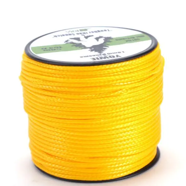A spool of bright yellow RNA YOWIE 1.8MM DYNEEMA THROWLINE wound tightly around a black plastic reel. The label on the top of the spool displays text and a logo with a fish, indicating brand and specifications. The background is plain white.