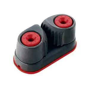 A Harken Standard Cam-Matic® Cleat – 150 with two cylindrical openings and grooves designed to grip a rope or line. The device has a sturdy base and is often used in sailing or boating to securely hold and adjust lines.