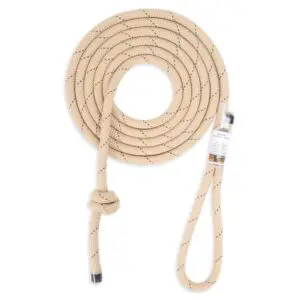 A coiled beige Ape Canyon Outfitters 9.5mm Rogue Tether with speckled black markings, featuring a spliced loop at one end and a knotted end at the other. The rope appears thick and sturdy, often used for climbing or rigging purposes.