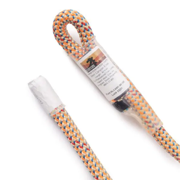 A 9mm Canyon Elite Rope 40' w/Squatch Splice with a blue, red, yellow, and white patterned sheath. One end of the rope is looped, and both ends are covered with protective shrink wrap. A product label is attached to the looped end.
