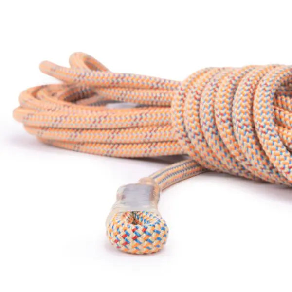 A close-up image of a coiled 9mm Canyon Elite Rope 40' w/Squatch Splice. The rope has a braided, durable texture with visible patterns of orange, blue, and white. A secured end knot wrapped in tape is prominently displayed in the foreground.