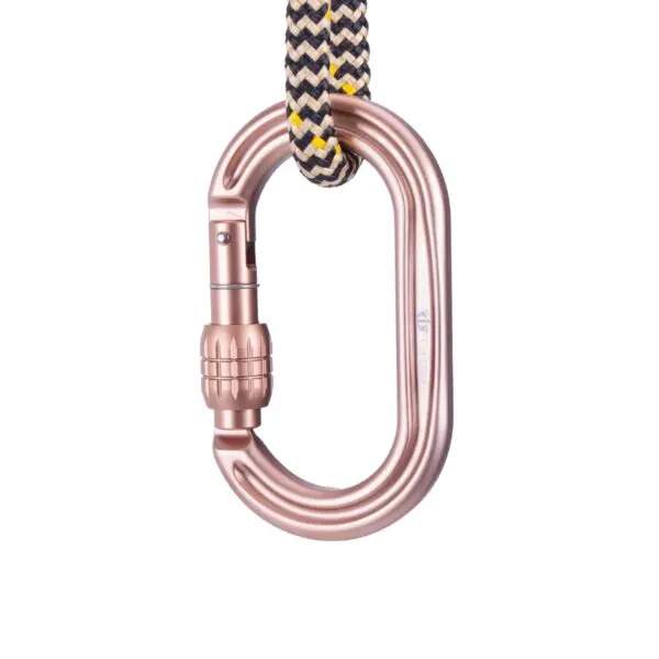 An Omega Pacific Raider Tactical Oval Screw-Lok Sand Tan is attached to a black, yellow, and white braided rope. The carabiner is designed with an oval shape and appears to be made of metal, likely used for climbing or securing equipment.