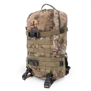 Ape Canyon Outfitters Conclave Pack Highlander with multiple straps and buckles. The bag features a top handle and MOLLE (Modular Lightweight Load-carrying Equipment) webbing on the front. A patch with a silhouette and text is visible near the top.