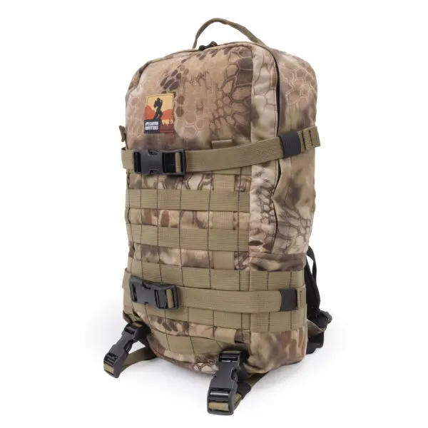 Ape Canyon Outfitters Conclave Pack Highlander with multiple straps and buckles. The bag features a top handle and MOLLE (Modular Lightweight Load-carrying Equipment) webbing on the front. A patch with a silhouette and text is visible near the top.