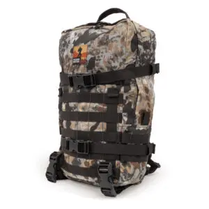 A camouflage-patterned Ape Canyon Outfitters Conclave Pack Highlander with multiple black straps and buckles. The pack has a fabric grab handle on top and an embroidered patch featuring a silhouette of a person and some text near the top. The design is outdoor or tactical in style.