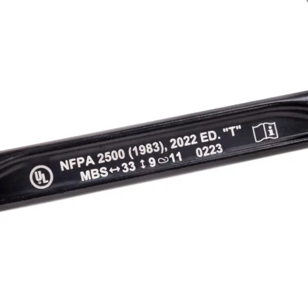 Close-up of a Custom Omega Pacific Standard D Aluminum Keylock Screw-Lok NFPA (5 Pack) with white text on it. The text reads, "UL NFPA 2500 (1983), 2022 ED. 'T' MBS ↔ 33 ↑ 9 11 0223," with various symbols alongside. The background is white, highlighting the black part.