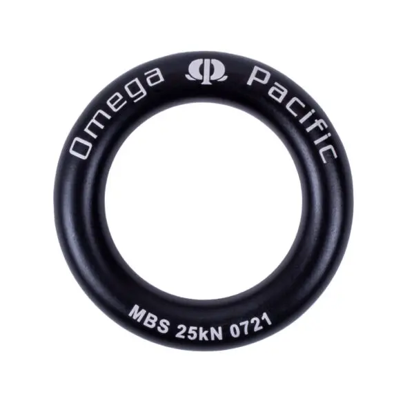 A black circular metal ring inscribed with "Omega Pacific" at the top and "MBS 25kN 0721" at the bottom, featuring the Omega Pacific logo centered at the top. This is one of the Omega Pacific Aluminum Rappel Rings.