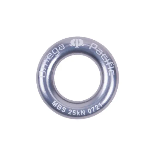 A round, metallic gray Omega Pacific Aluminum Rappel Ring with "Omega Pacific" printed on it. The bottom of the ring has text that reads "MBS 25kN 0721." The ring has a smooth finish and is used in climbing for safety and support.