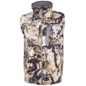 A Kryptek Dalibor Vest featuring a camouflage pattern of various shades of brown, tan, and white. The vest has a high collar and a vertical zipper front, with a small zippered chest pocket. The brand logo "FIRST LITE" is visible on the chest.