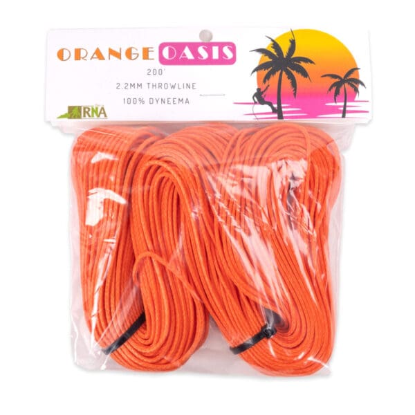 Packaging of "Ape Canyon Outfitters 2.2mm Orange Oasis" 200 feet, 2.2mm throwline made from 100% Dyneema. The packaging shows bright orange rope coiled for use, with a graphic of a tropical sunset featuring palm trees and a person sitting by the water. The RNA logo appears in the corner.