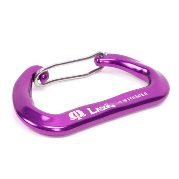 A purple Omega Pacific Lava Wiregate with a silver wire gate. The carabiner has "Lova" and the phrase "It is possible" engraved on its side. The carabiner is placed on a plain white background.