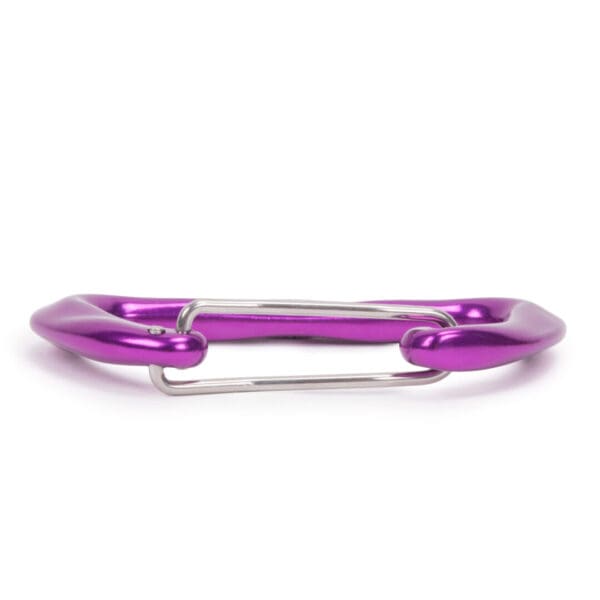 A purple Omega Pacific Lava Wiregate with a sleek, polished finish and a metal gate. The Omega Pacific Lava Wiregate is designed for climbing and securing gear, laying flat against a white background.