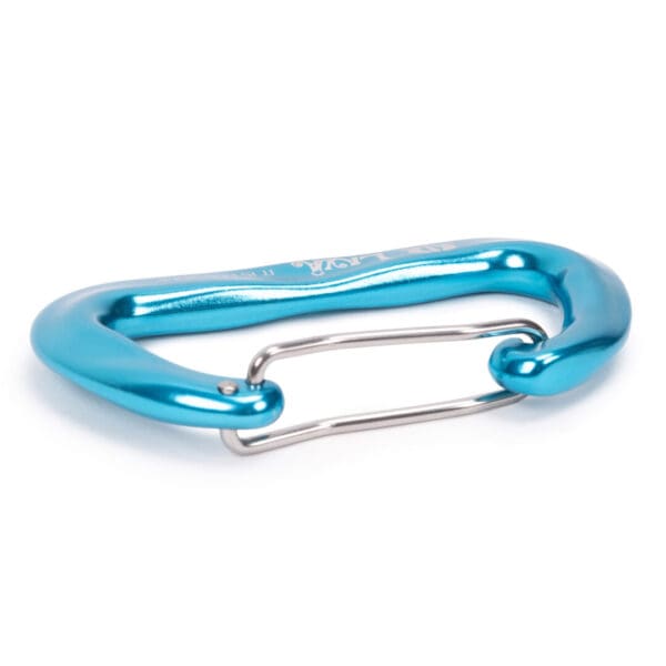 A blue Omega Pacific Lava Wiregate is shown. The carabiner has a shiny, metallic finish and is designed for climbing or securing equipment. The wire gate is silver and curved, connecting two ends of the carabiner.