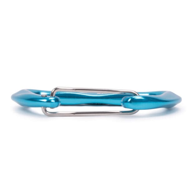 A close-up view of an Omega Pacific Lava Wiregate with a silver latch. The carabiner is made of metal and designed for securing or holding objects together. The background is white.