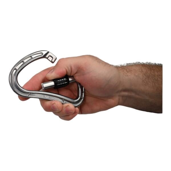 A hand holding a metallic Omega Pacific Phantom Aluminum Keylock Screw-Lok - Gunmetal with a black twist-lock mechanism on a white background. The carabiner is partially open, showing the locking feature in detail.