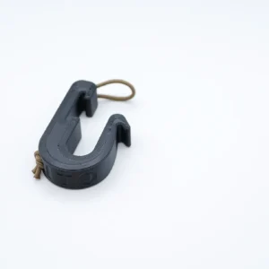 A Universal Platform Saddle Aid with an attached brown elastic band is placed on a plain white background. The hook appears to be sturdy and has a design suitable for holding or hanging items.