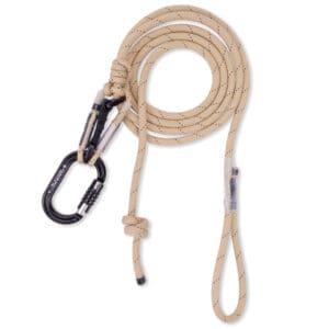 A coiled beige Ape Canyon Outfitters Rogue Tether Kit with black speckles, featuring a black carabiner for securing. The kit has an adjustable loop and a knotted section for added grip or attachment. The carabiner is clipped onto a loop at one end of the rope.