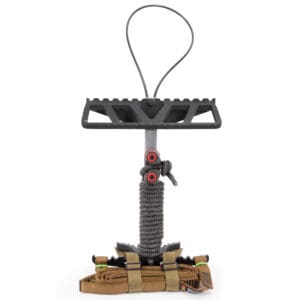 The Scout One Stick is a compact metal hunting platform featuring a gritted standing surface, a looped strap for easy hanging, and a cord-wrapped grip. Below the platform is a secured, foldable step system complete with an attached tan strap, specifically designed for tree-based hunting activities.